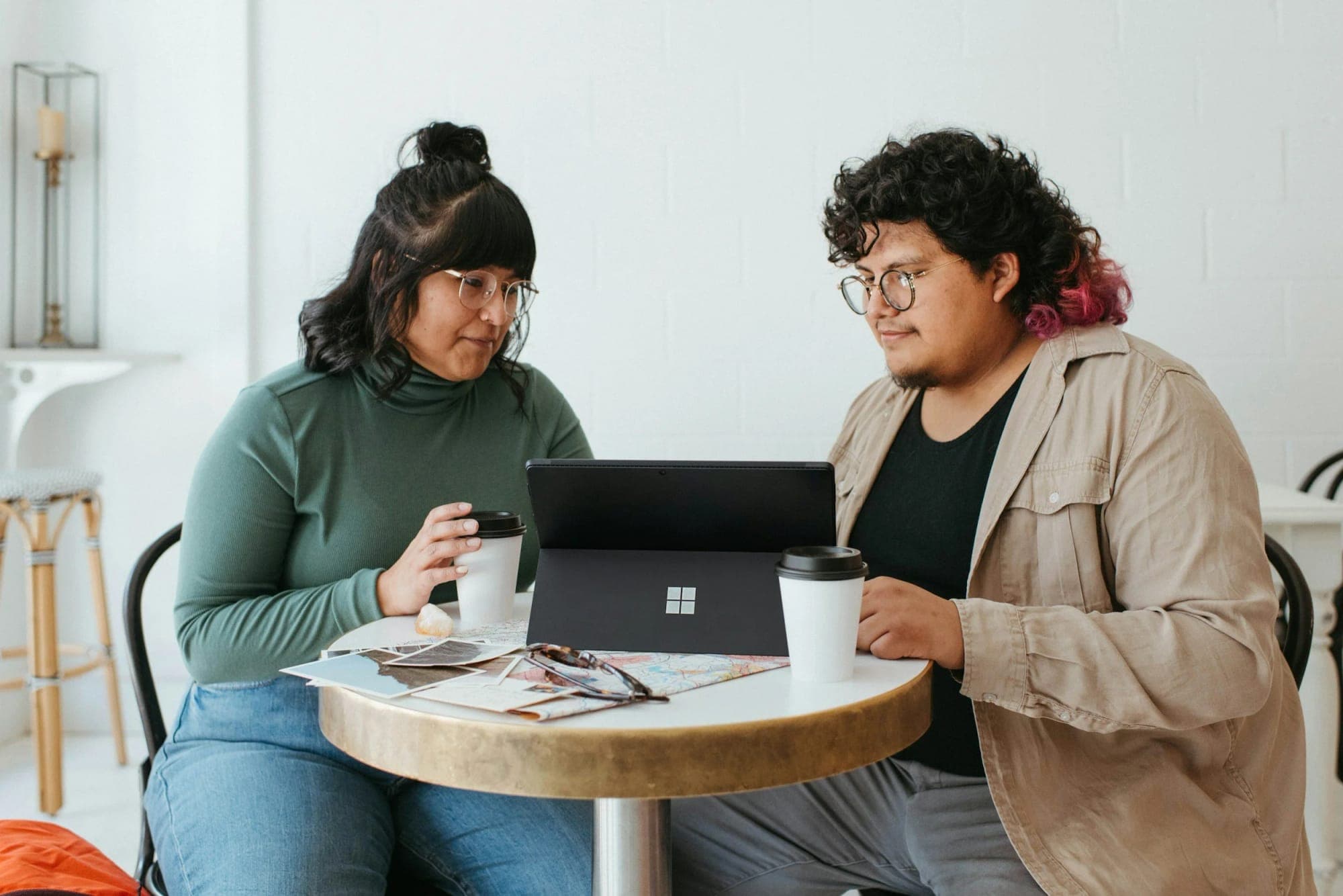 Two colleagues working together at a laptop