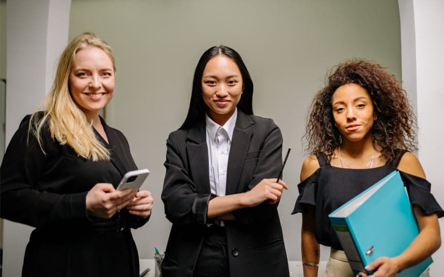 Three professional women standing together