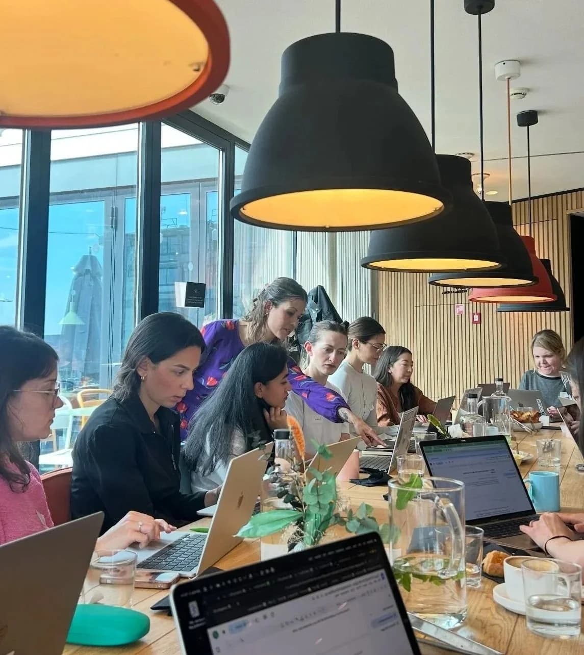 Participants working on laptops during an AI workshop