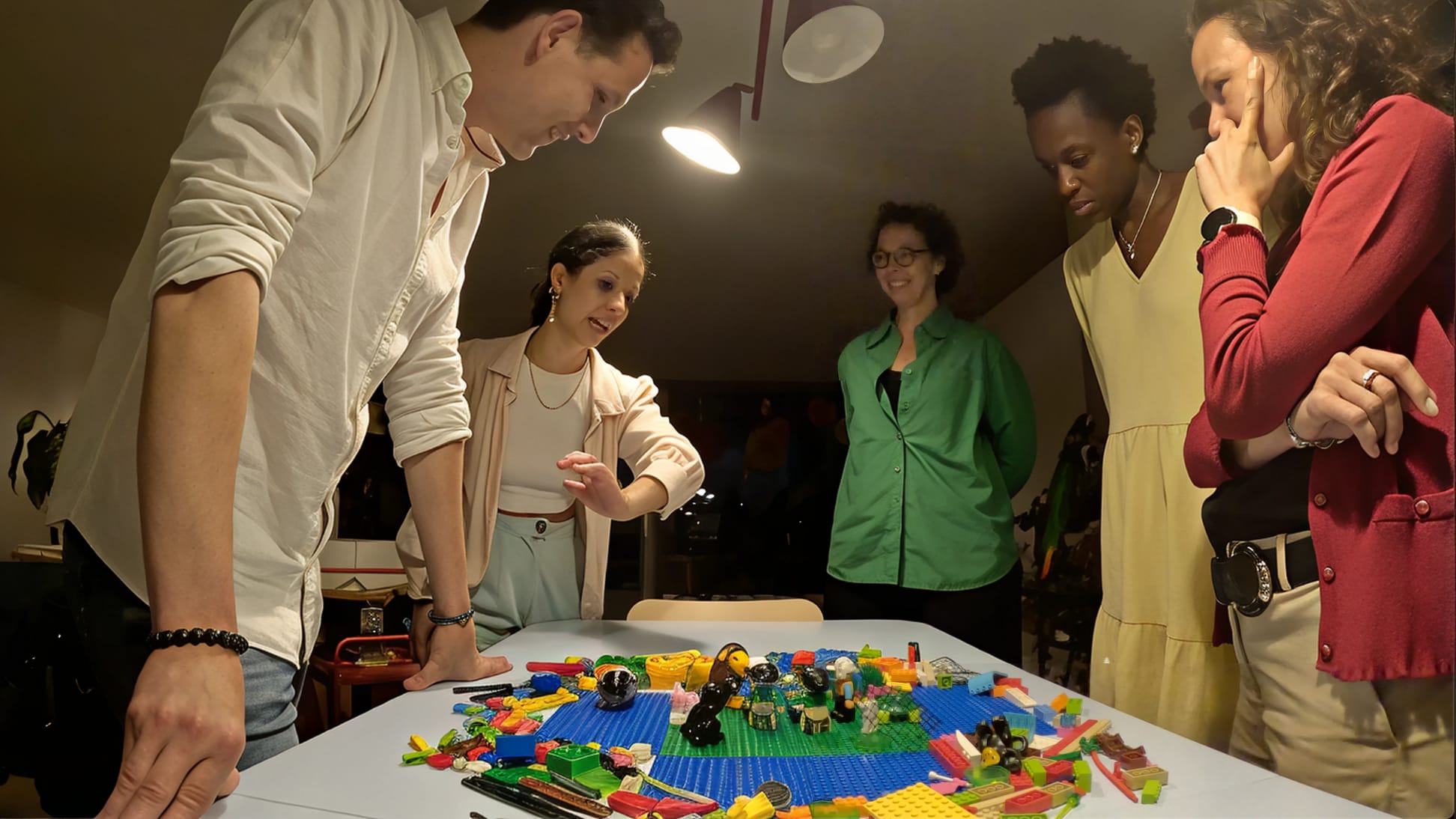 Colleagues building LEGO® models together around a table